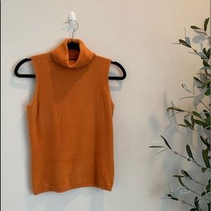 Orange sleeveless turtleneck sweater